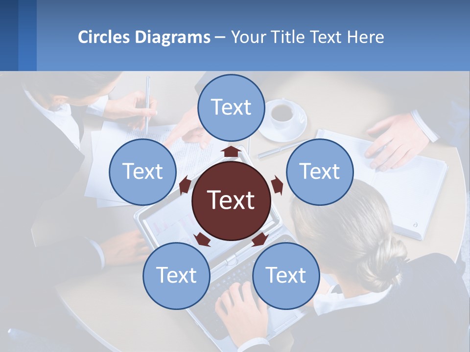 A Group Of People Sitting Around A Table Working On A Laptop PowerPoint Template