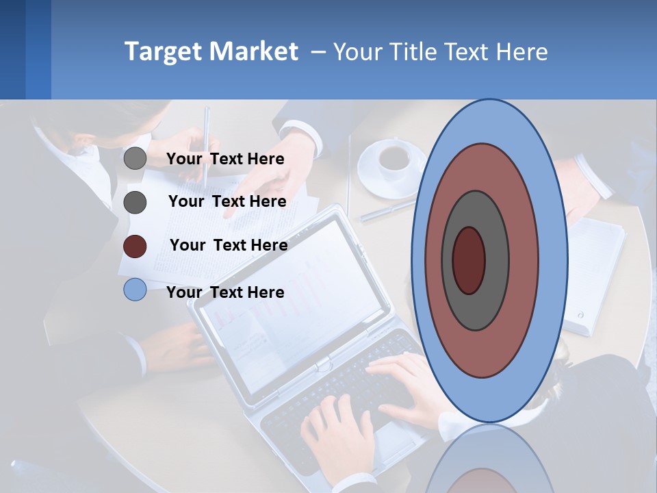 A Group Of People Sitting Around A Table Working On A Laptop PowerPoint Template