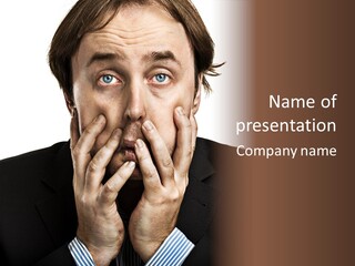 A Man In A Suit Covers His Mouth With His Hands PowerPoint Template
