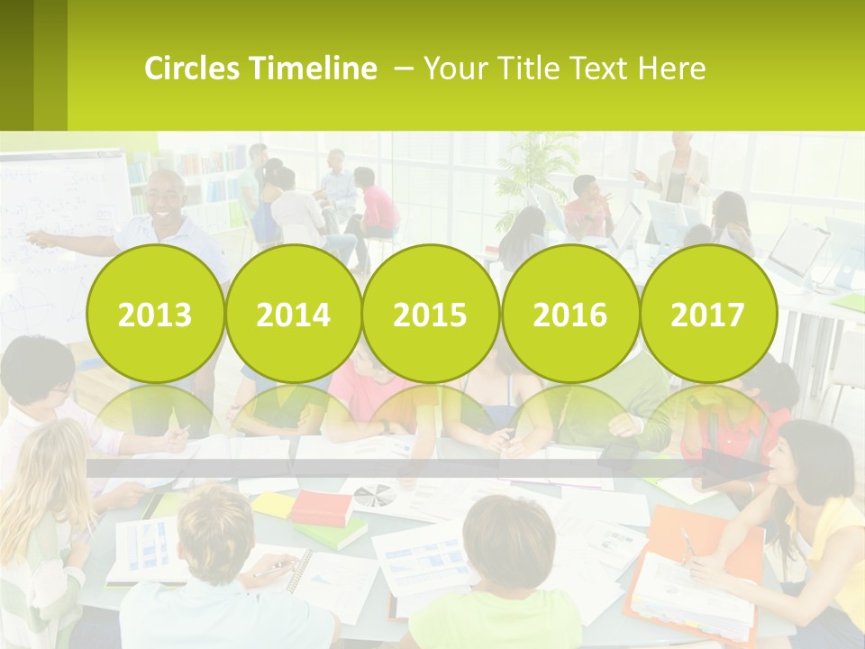 A Group Of People Sitting Around A Table With Papers PowerPoint Template