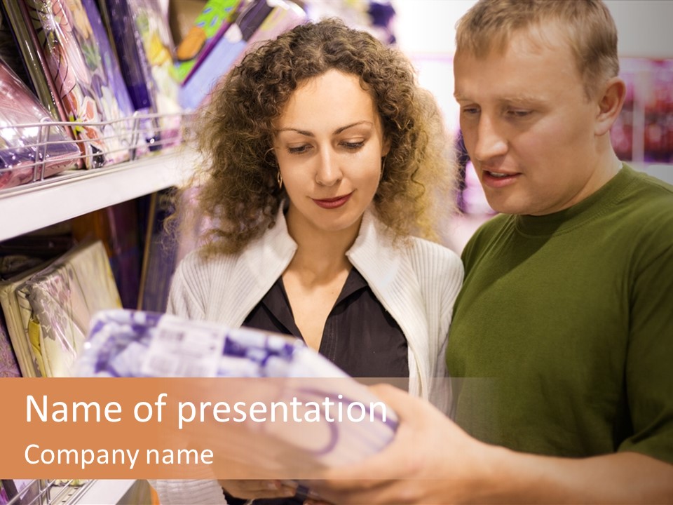 A Man And Woman Looking At A Package In A Store PowerPoint Template