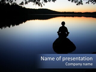 A Person Sitting On A Rock In Front Of A Body Of Water PowerPoint Template