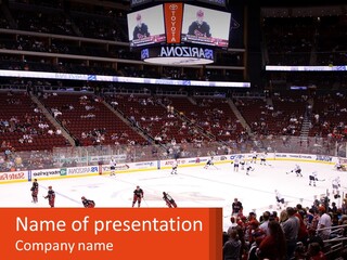 A Hockey Game Is Being Played In A Stadium PowerPoint Template