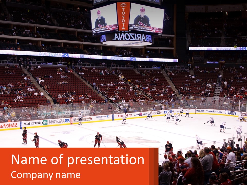 A Hockey Game Is Being Played In A Stadium PowerPoint Template
