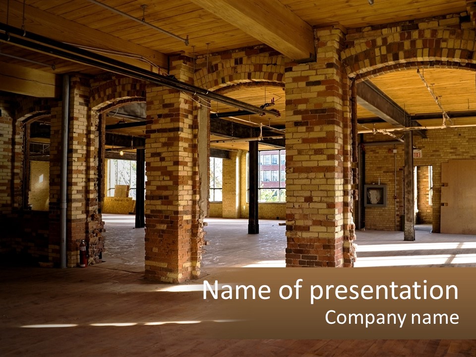 A Large Room With Brick Pillars And Windows PowerPoint Template