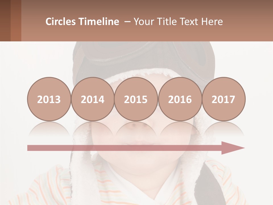 A Baby Wearing A Monkey Hat With A Name Tag PowerPoint Template