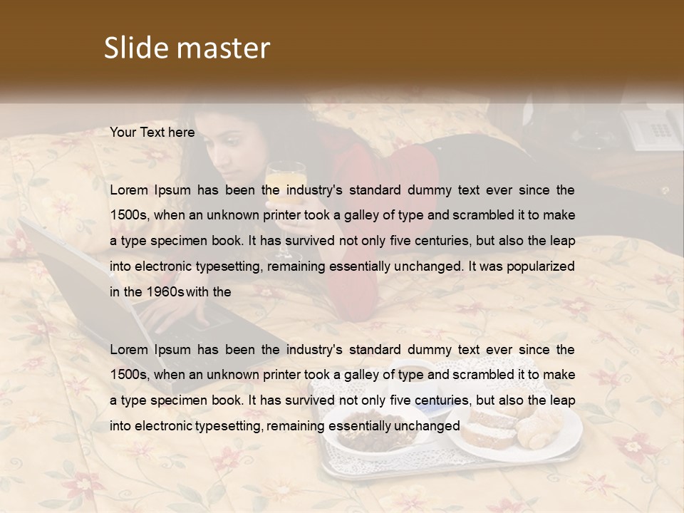 A Woman Laying On A Bed With A Laptop And A Glass Of Orange Juice PowerPoint Template