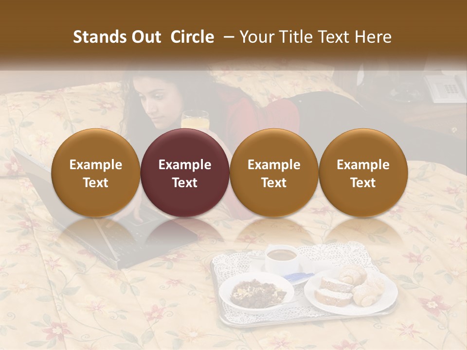 A Woman Laying On A Bed With A Laptop And A Glass Of Orange Juice PowerPoint Template