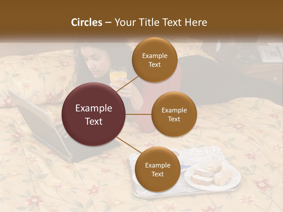 A Woman Laying On A Bed With A Laptop And A Glass Of Orange Juice PowerPoint Template