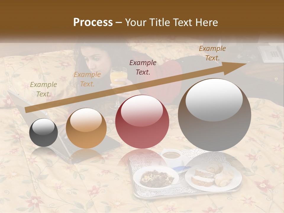 A Woman Laying On A Bed With A Laptop And A Glass Of Orange Juice PowerPoint Template