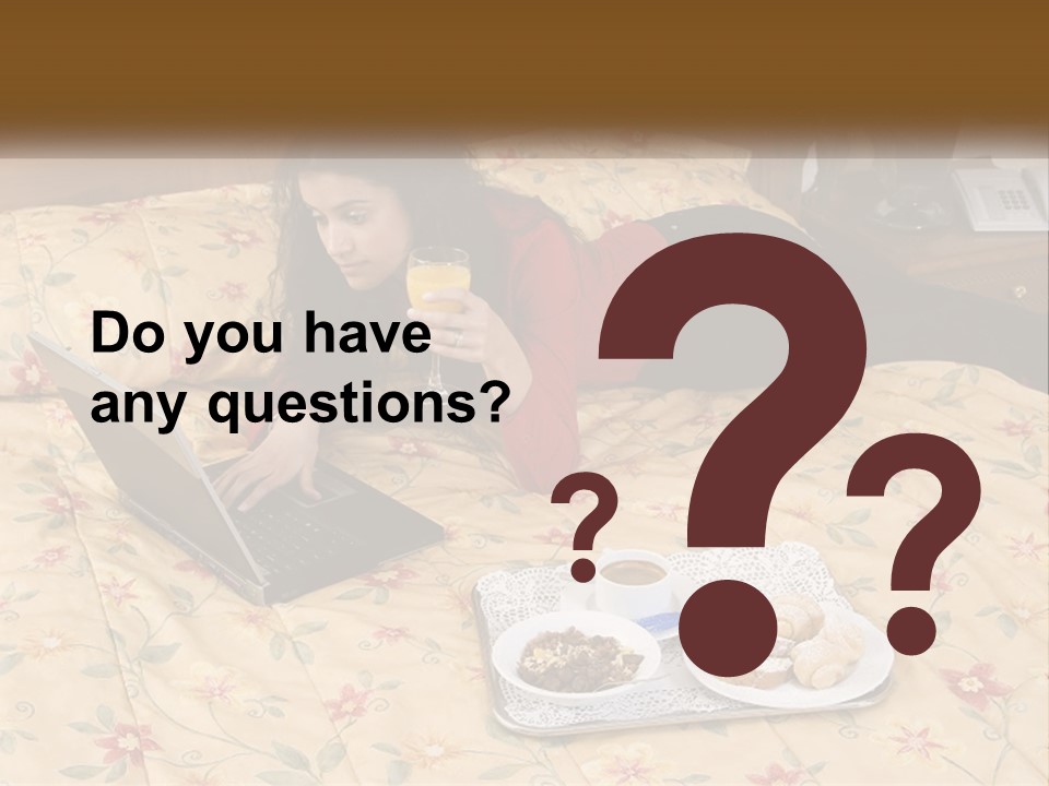 A Woman Laying On A Bed With A Laptop And A Glass Of Orange Juice PowerPoint Template