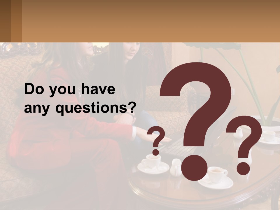 Two Women Sitting On A Couch Looking At A Laptop PowerPoint Template