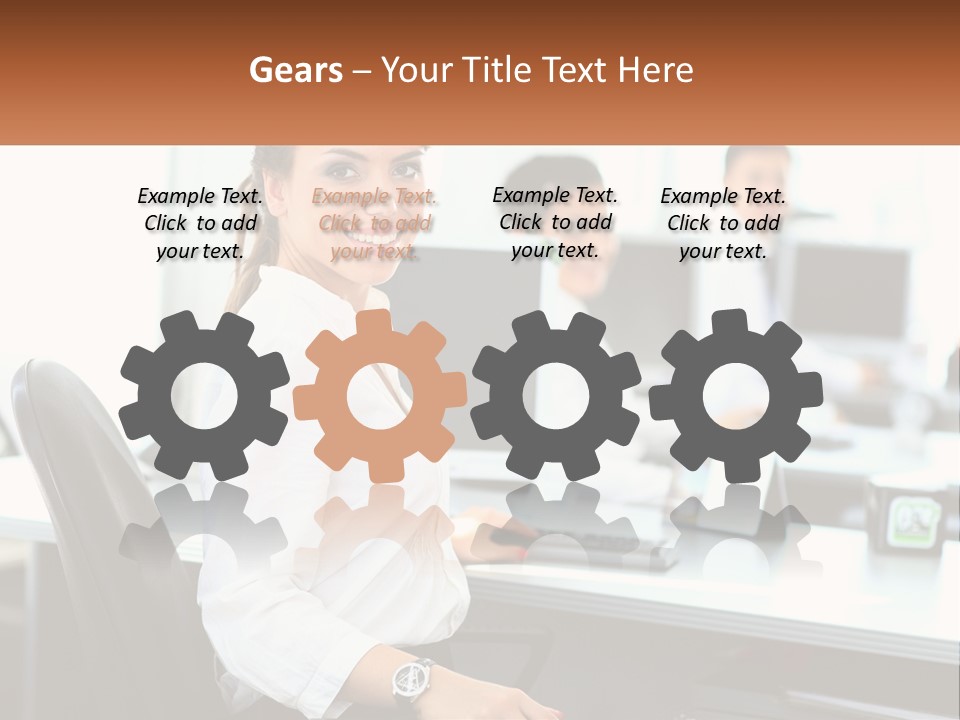 A Woman Sitting At A Desk In An Office PowerPoint Template