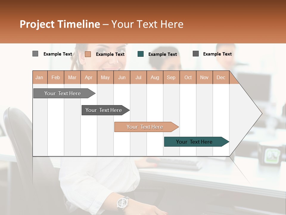 A Woman Sitting At A Desk In An Office PowerPoint Template