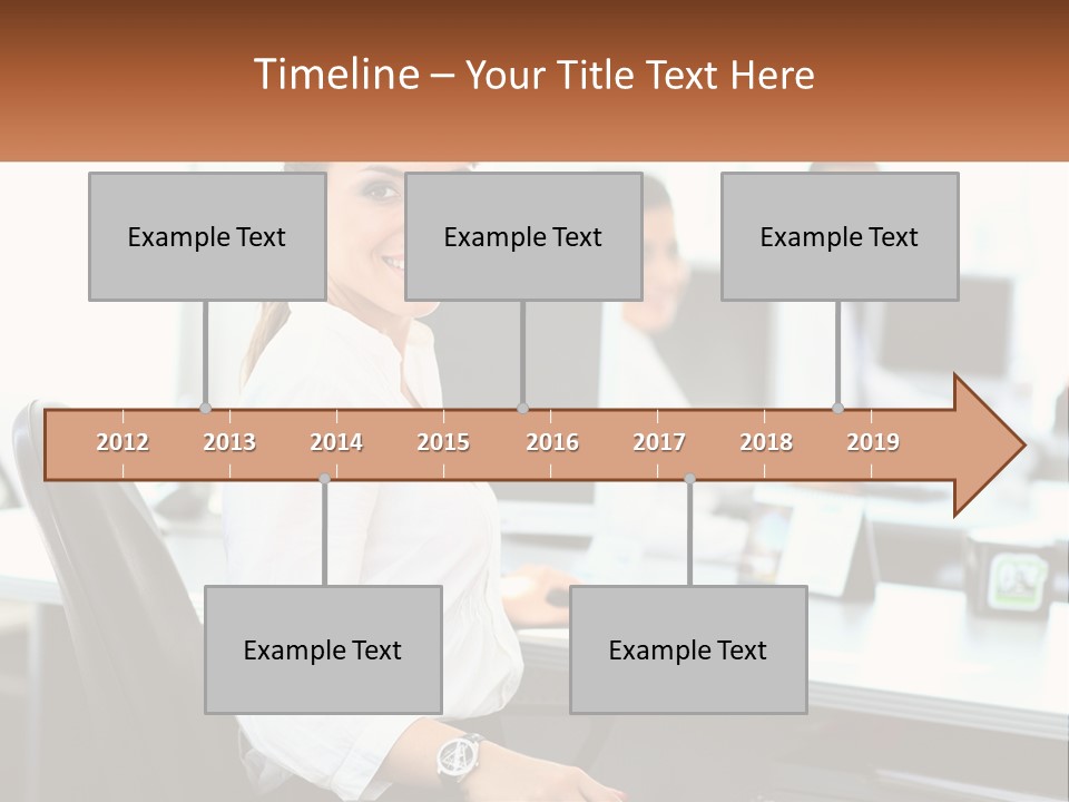 A Woman Sitting At A Desk In An Office PowerPoint Template