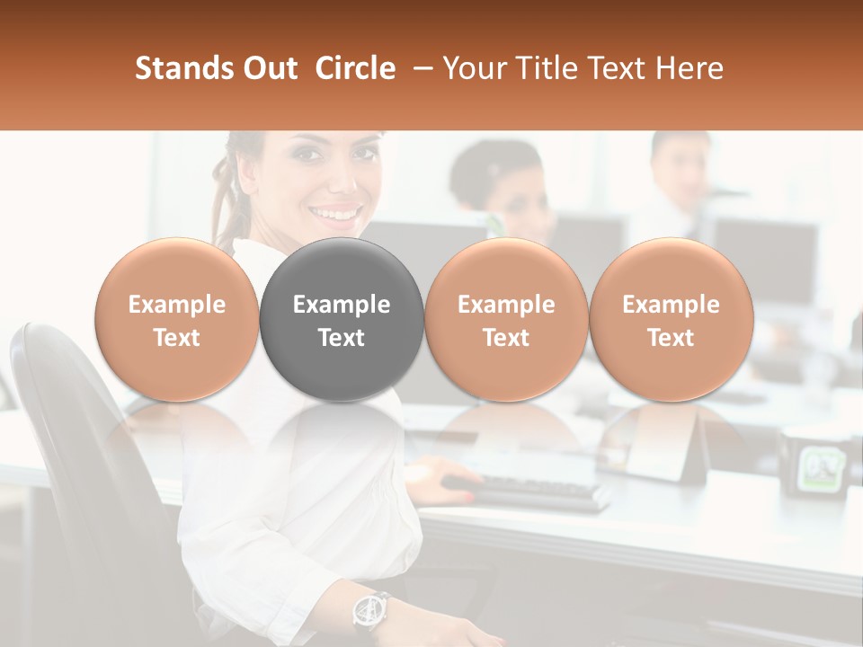 A Woman Sitting At A Desk In An Office PowerPoint Template