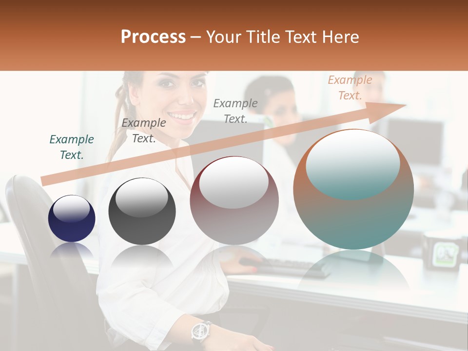 A Woman Sitting At A Desk In An Office PowerPoint Template