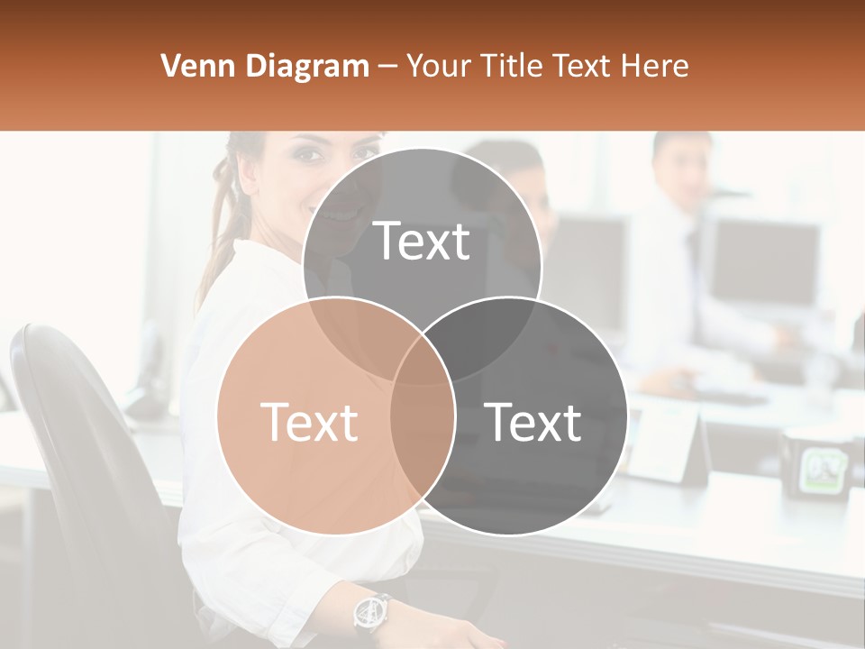 A Woman Sitting At A Desk In An Office PowerPoint Template