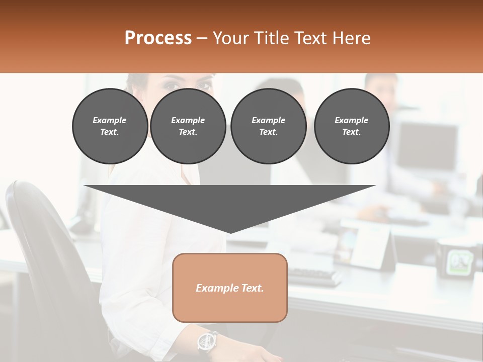 A Woman Sitting At A Desk In An Office PowerPoint Template