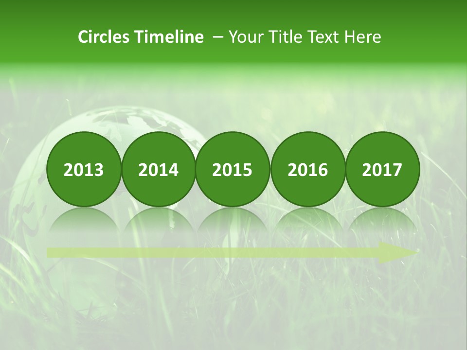 A Green Globe In The Grass Powerpoint Template PowerPoint Template