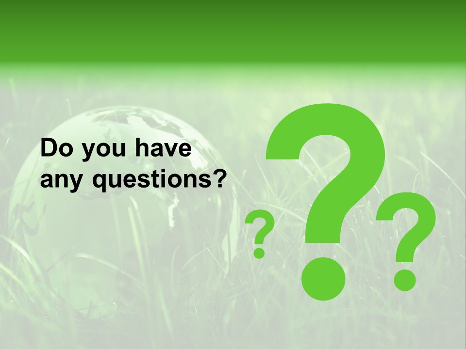 A Green Globe In The Grass Powerpoint Template PowerPoint Template