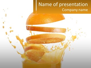 An Orange Is Falling Into A Glass Of Orange Juice PowerPoint Template