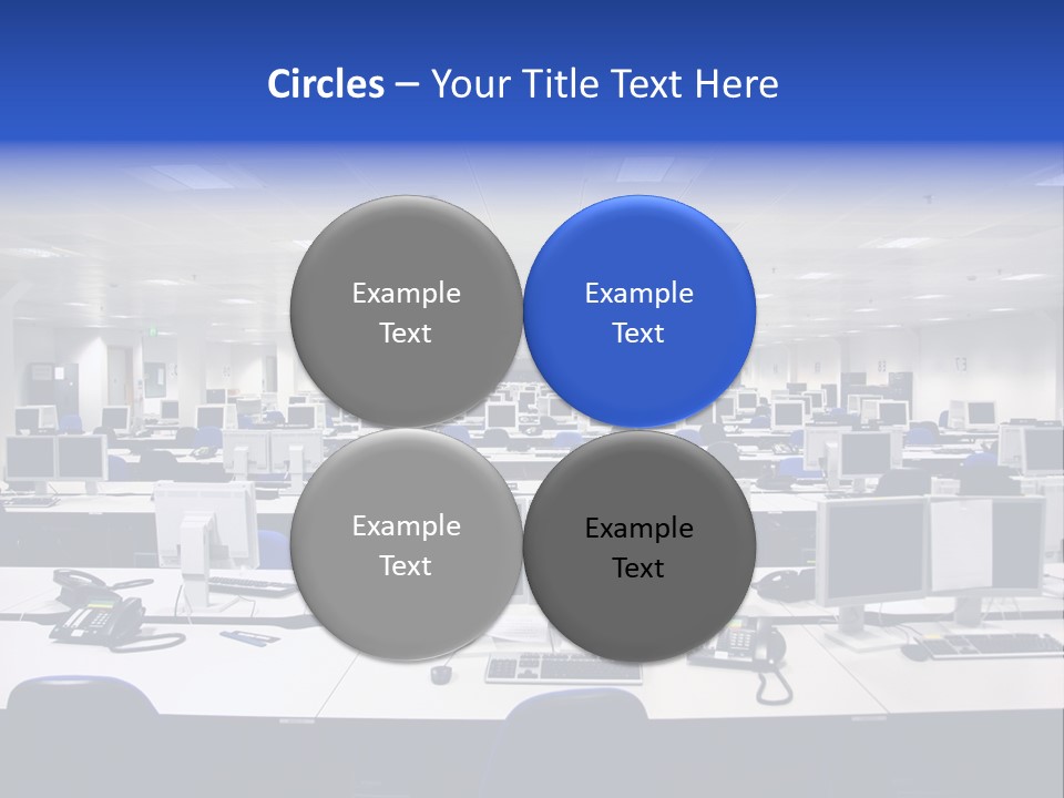 A Room Full Of Computer Monitors And Keyboards PowerPoint Template