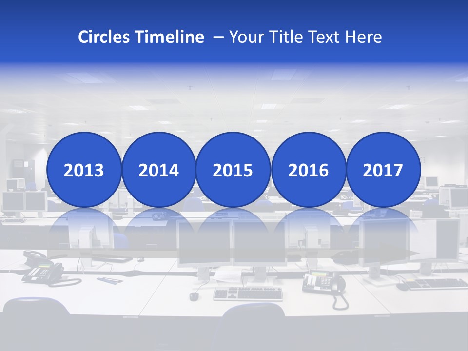 A Room Full Of Computer Monitors And Keyboards PowerPoint Template