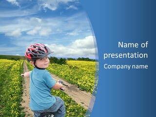 A Young Boy Riding A Bike Down A Dirt Road PowerPoint Template