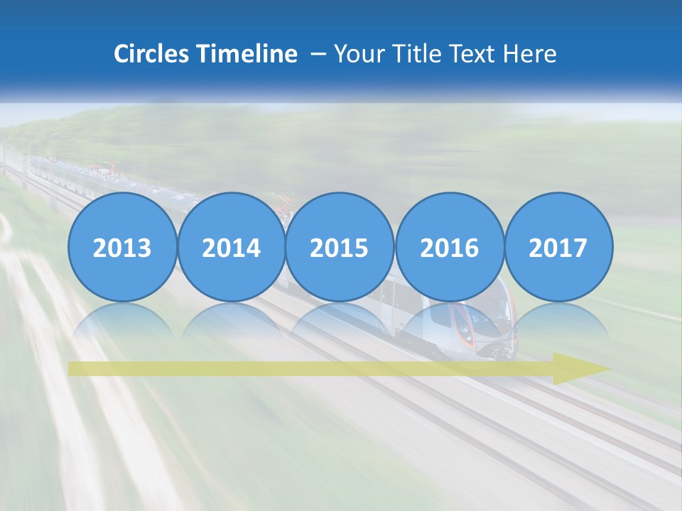 A Train Traveling Down A Track With Trees In The Background PowerPoint Template