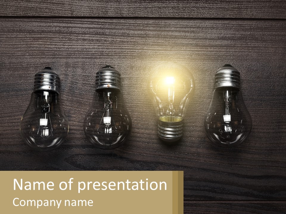 A Group Of Light Bulbs Sitting On Top Of A Wooden Table PowerPoint Template