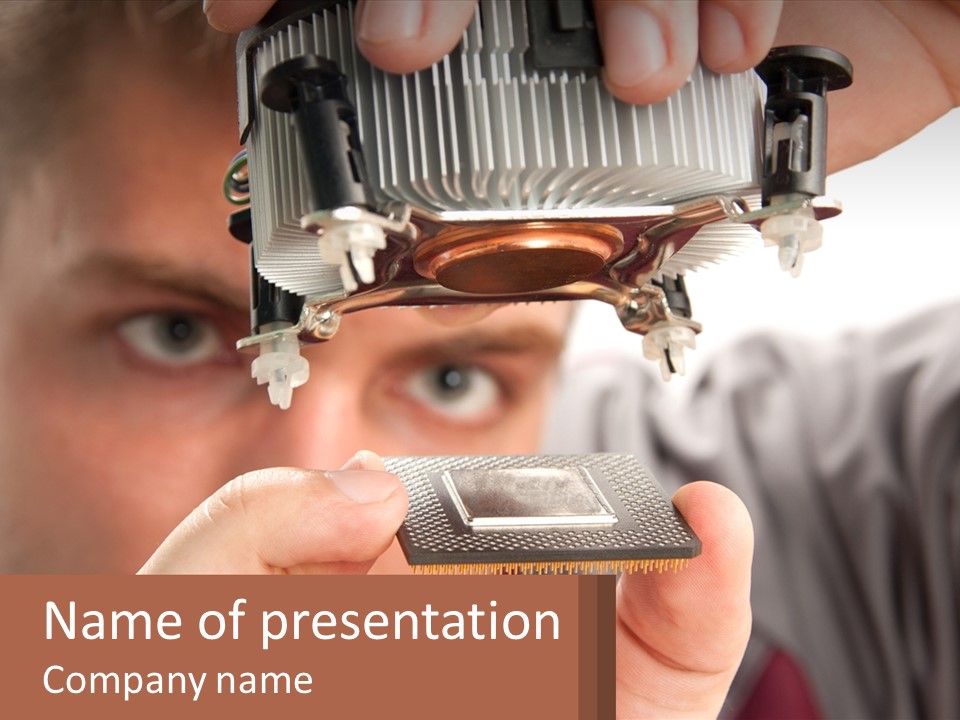 A Man Holding Up A Piece Of Metal In Front Of His Face PowerPoint Template
