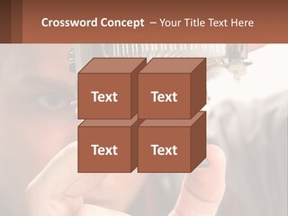 A Man Holding Up A Piece Of Metal In Front Of His Face PowerPoint Template