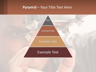 A Man Holding Up A Piece Of Metal In Front Of His Face PowerPoint Template