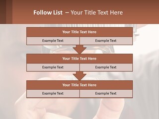A Man Holding Up A Piece Of Metal In Front Of His Face PowerPoint Template