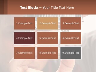 A Man Holding Up A Piece Of Metal In Front Of His Face PowerPoint Template