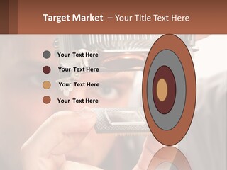 A Man Holding Up A Piece Of Metal In Front Of His Face PowerPoint Template