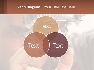 A Man Holding Up A Piece Of Metal In Front Of His Face PowerPoint Template