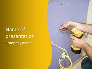 A Man Is Using A Power Drill On A Wall PowerPoint Template