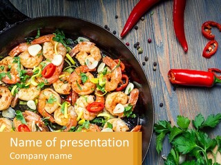 A Pan Filled With Shrimp And Vegetables On Top Of A Wooden Table PowerPoint Template