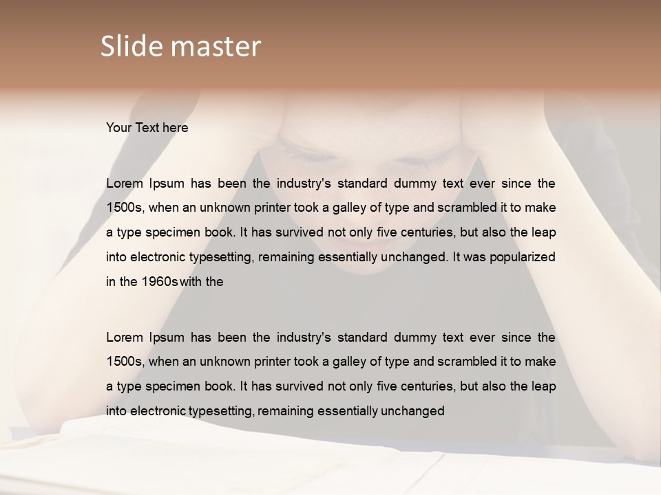 A Young Boy Sitting At A Desk With His Hands On His Head PowerPoint Template