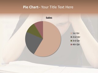 A Young Boy Sitting At A Desk With His Hands On His Head PowerPoint Template