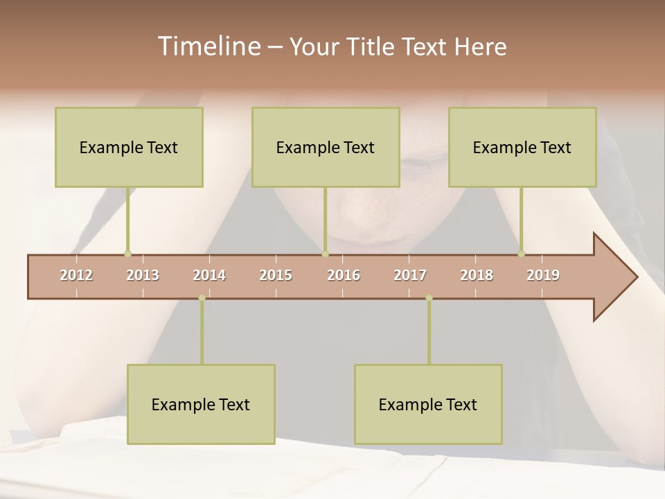 A Young Boy Sitting At A Desk With His Hands On His Head PowerPoint Template
