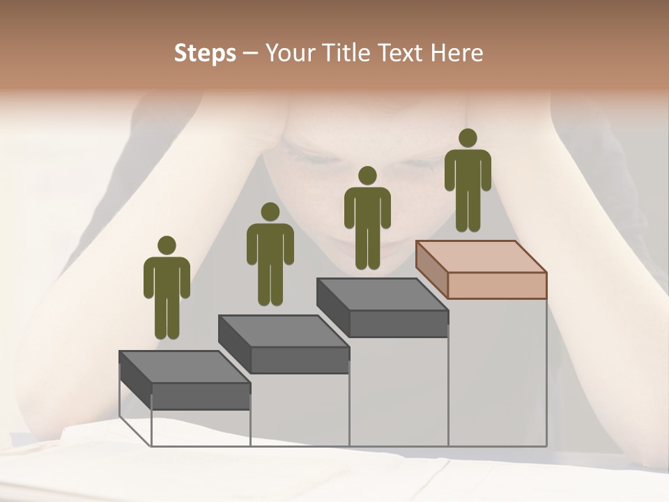 A Young Boy Sitting At A Desk With His Hands On His Head PowerPoint Template