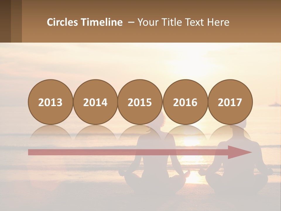 Two People Are Sitting On The Beach At Sunset PowerPoint Template