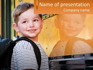 A Young Boy Is Standing In Front Of A School Bus PowerPoint Template