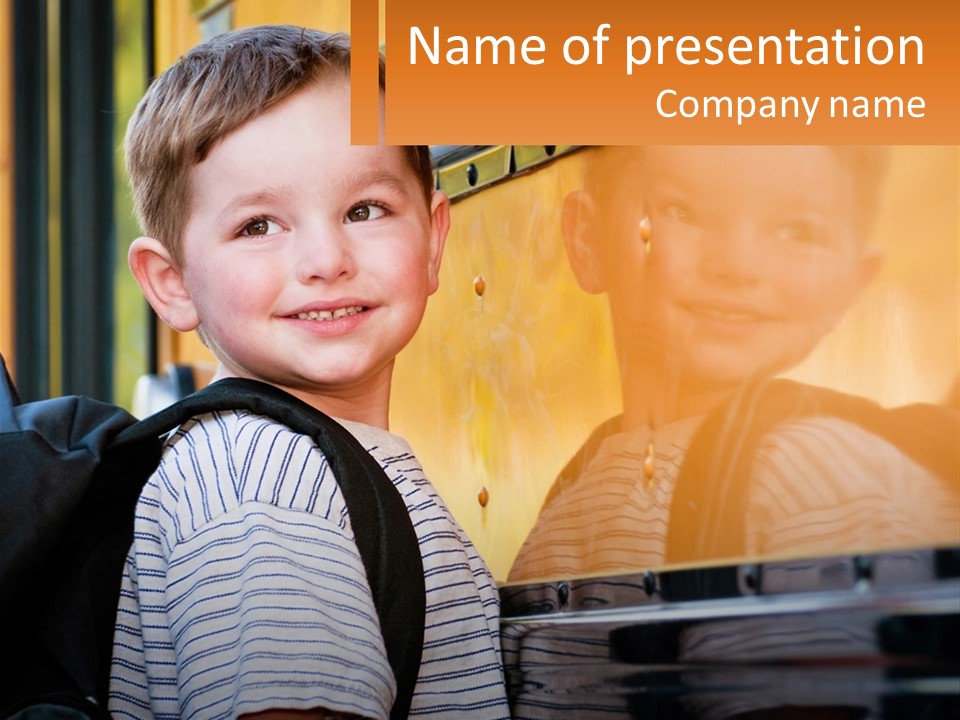 A Young Boy Is Standing In Front Of A School Bus PowerPoint Template