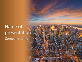 An Aerial View Of A City At Sunset PowerPoint Template
