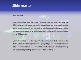 A Power Plant Lit Up At Night With Green And Blue Lights PowerPoint Template