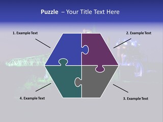 A Power Plant Lit Up At Night With Green And Blue Lights PowerPoint Template